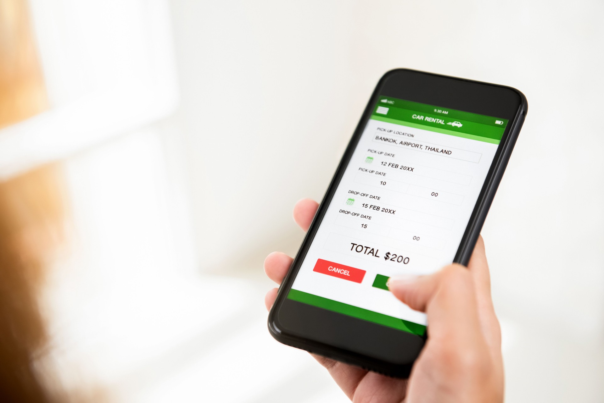 Woman booking car online from mobile phone application